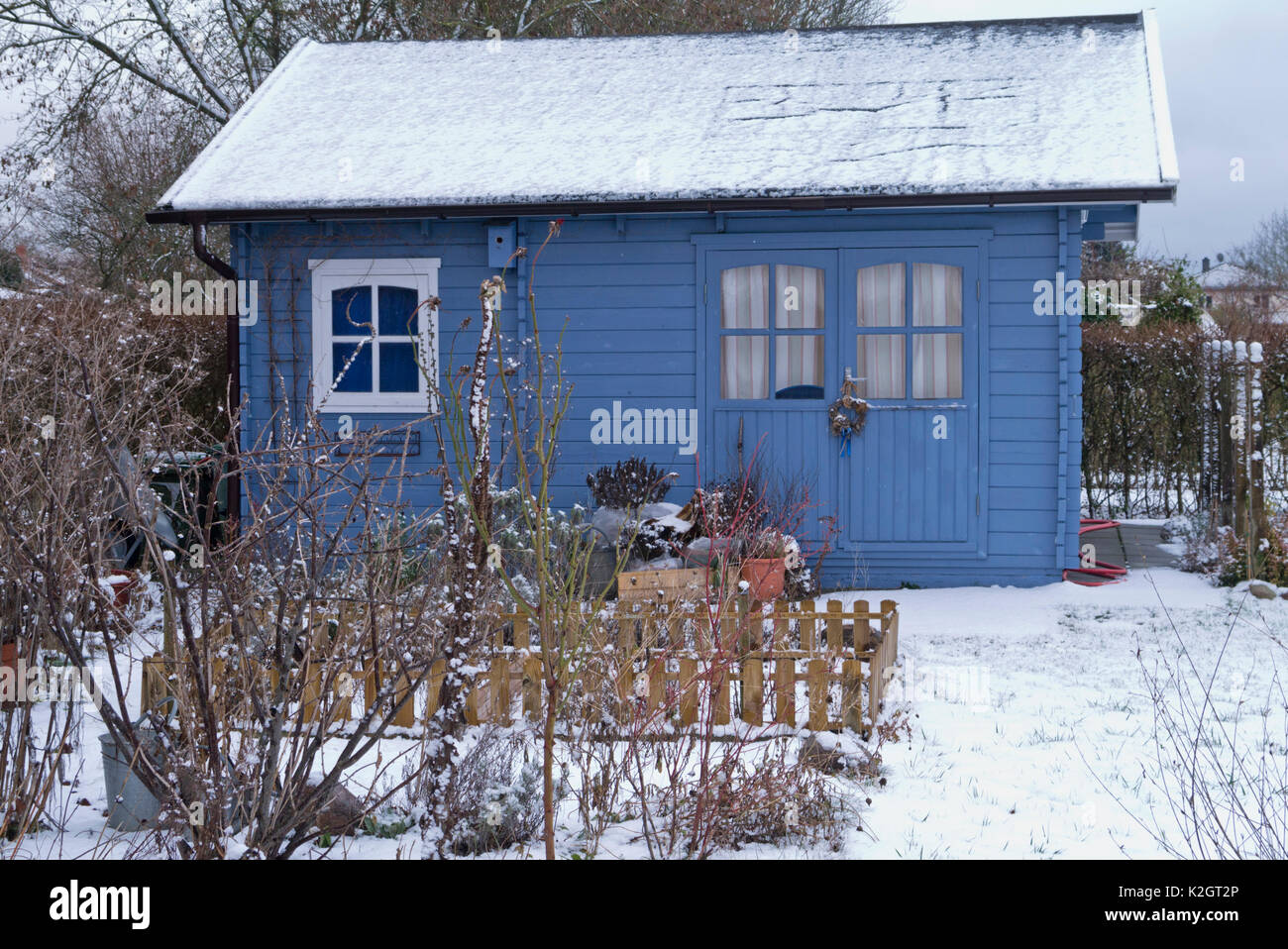 Blue garden house in a wintery allotment garden Stock Photo
