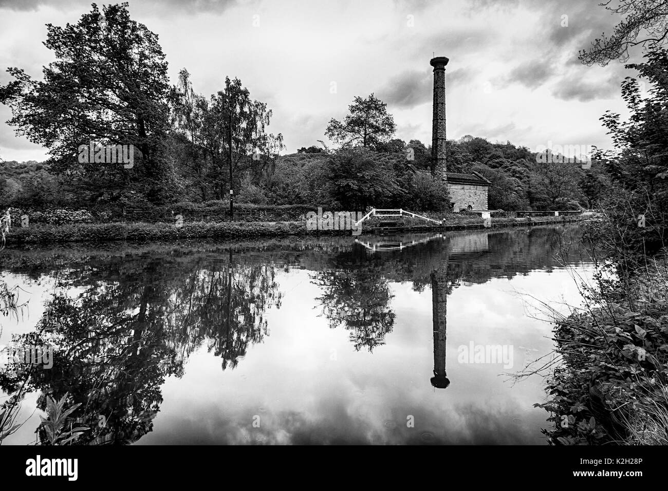 Leawood Pumphouse at Cromford Canal in Derbyshire on the edge of the Peak District. This is a black and white image capturing a beautiful reflection. Stock Photo