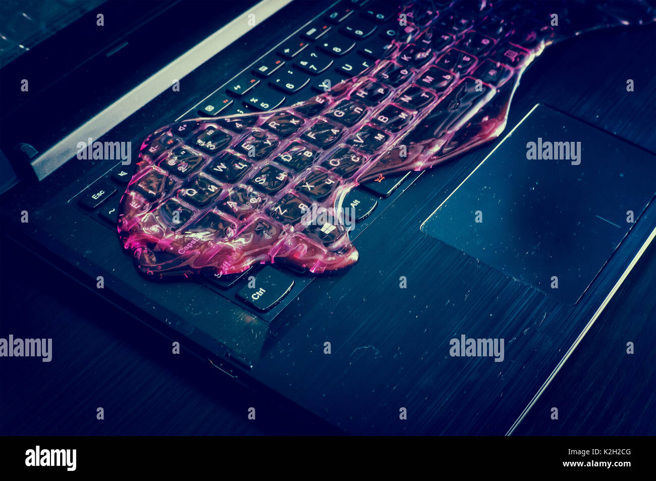 The red slime spread on the computer keyboard. Tools for quick cleaning ...