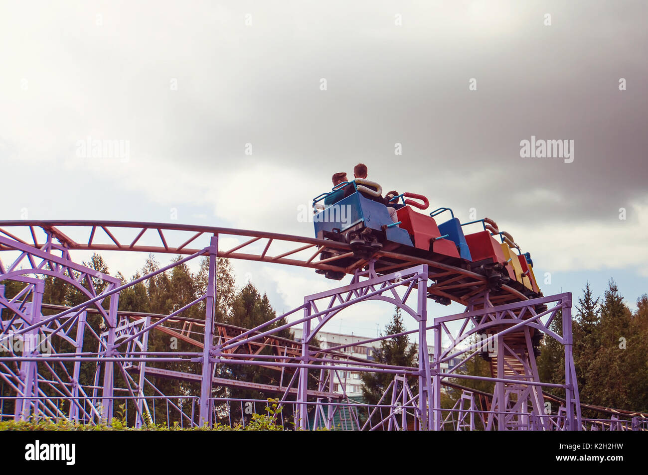 Roller coaster track blue sky at amusement park. people ride the dangerous rides Stock Photo Alamy