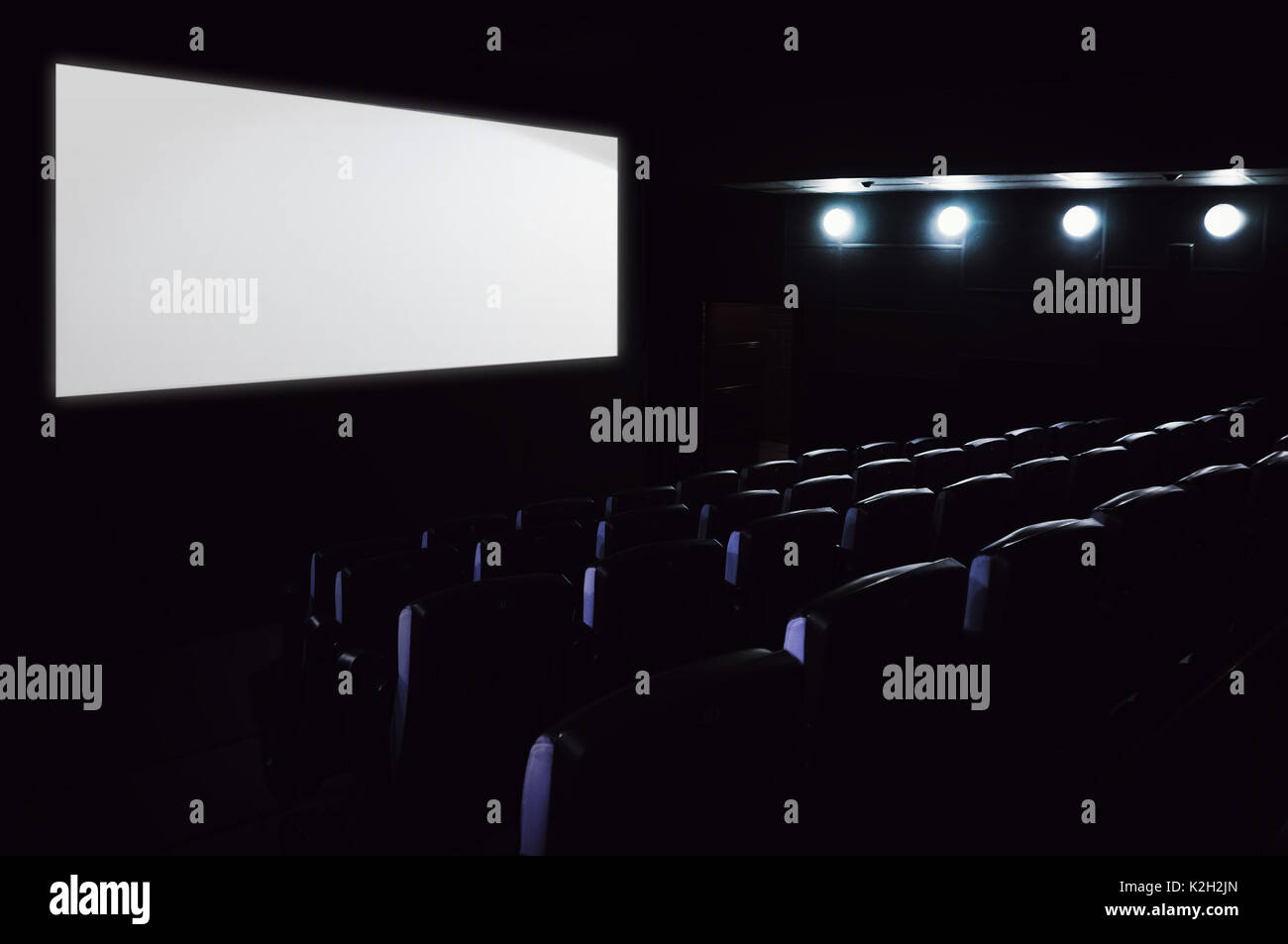 Empty cinema hall. White screen space for text Stock Photo