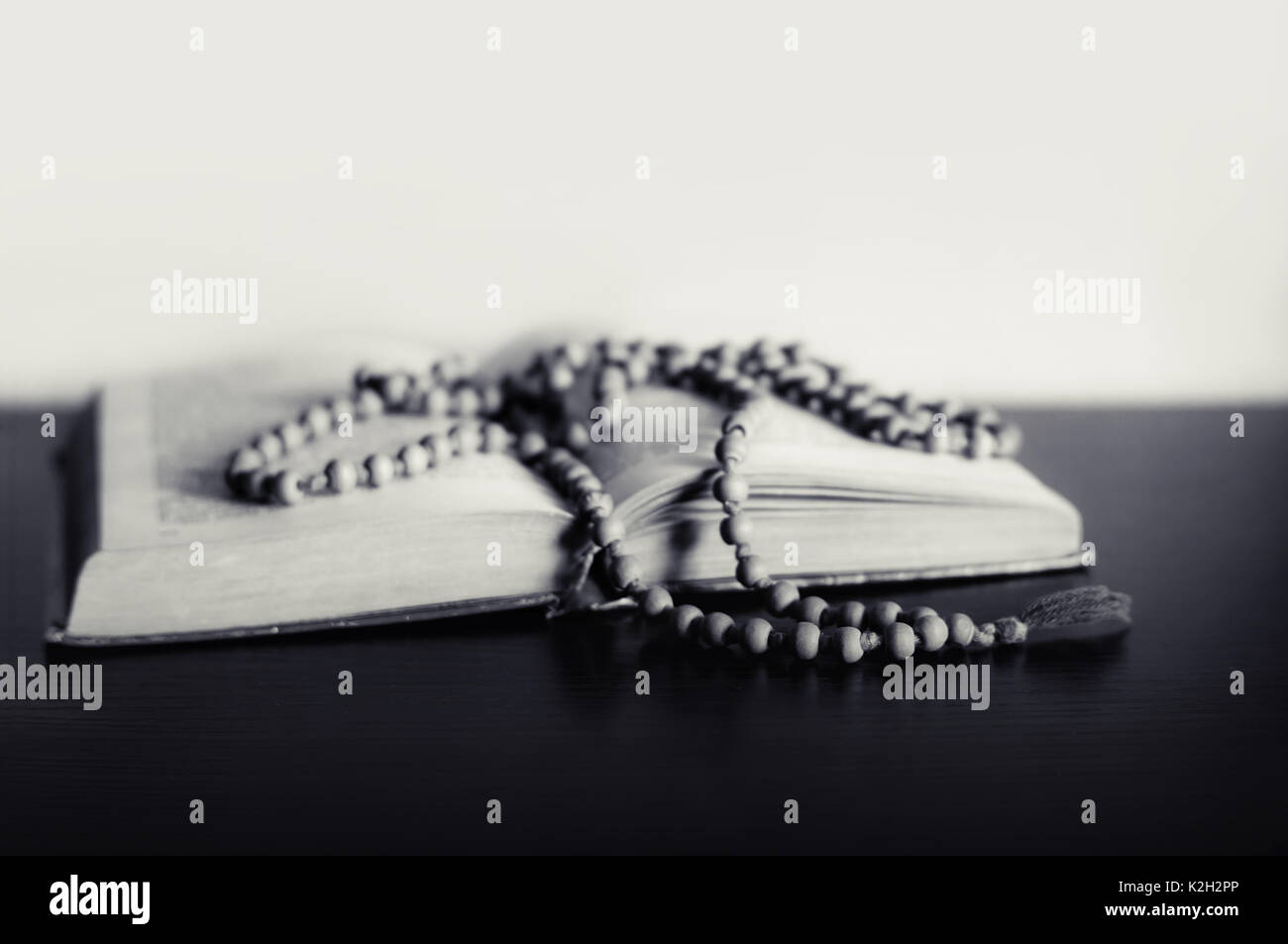 Bible and the crucifix on a table. Beautiful background.Religion