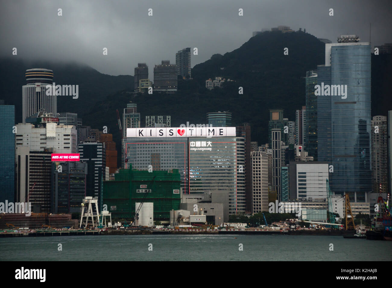 Kiss time panel on a building in Hong Kong Stock Photo