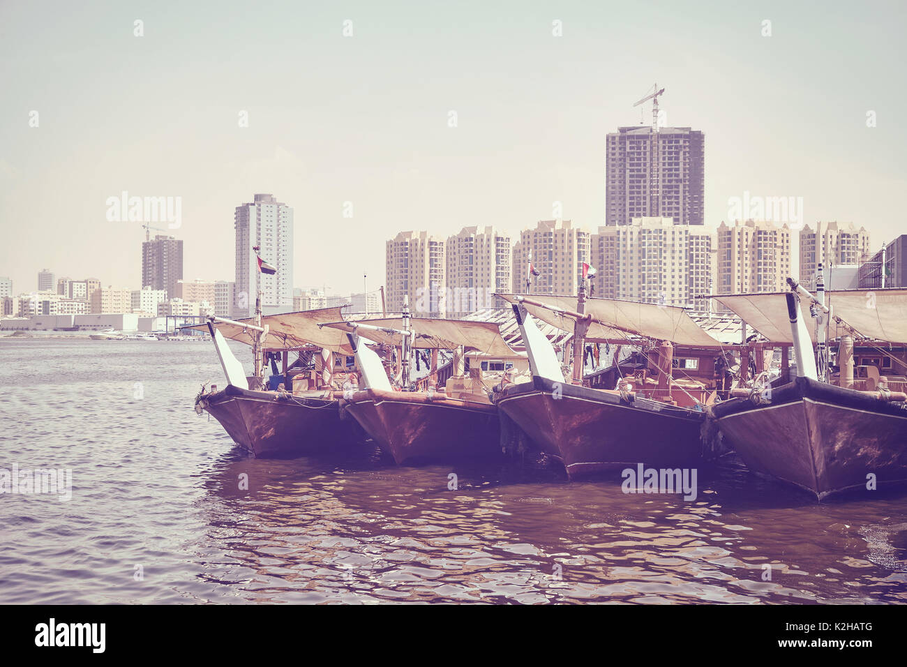 Fishing boats at Ajman fish market pier, color toning applied, United Arab Emirates. Stock Photo