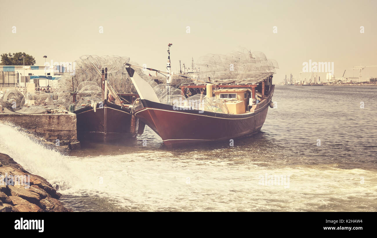 Fishing boats in Ajman harbor, color toning applied, United Arab Emirates. Stock Photo