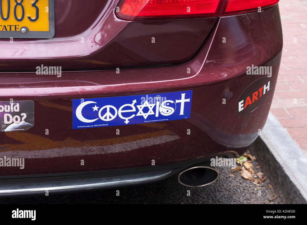 A COEXIST bumper sticker on a car showing the symbols of different religions in an effort to promote tolerance and multiculturalism. Stock Photo