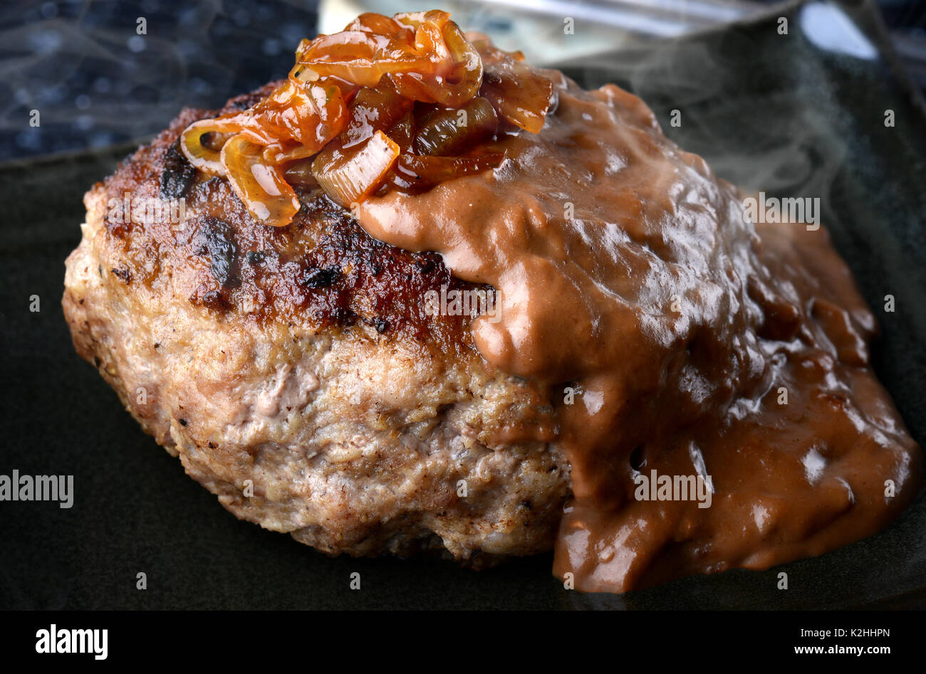 Hamburger steak in Japanese style or hambagu serve with fresh vegetable
