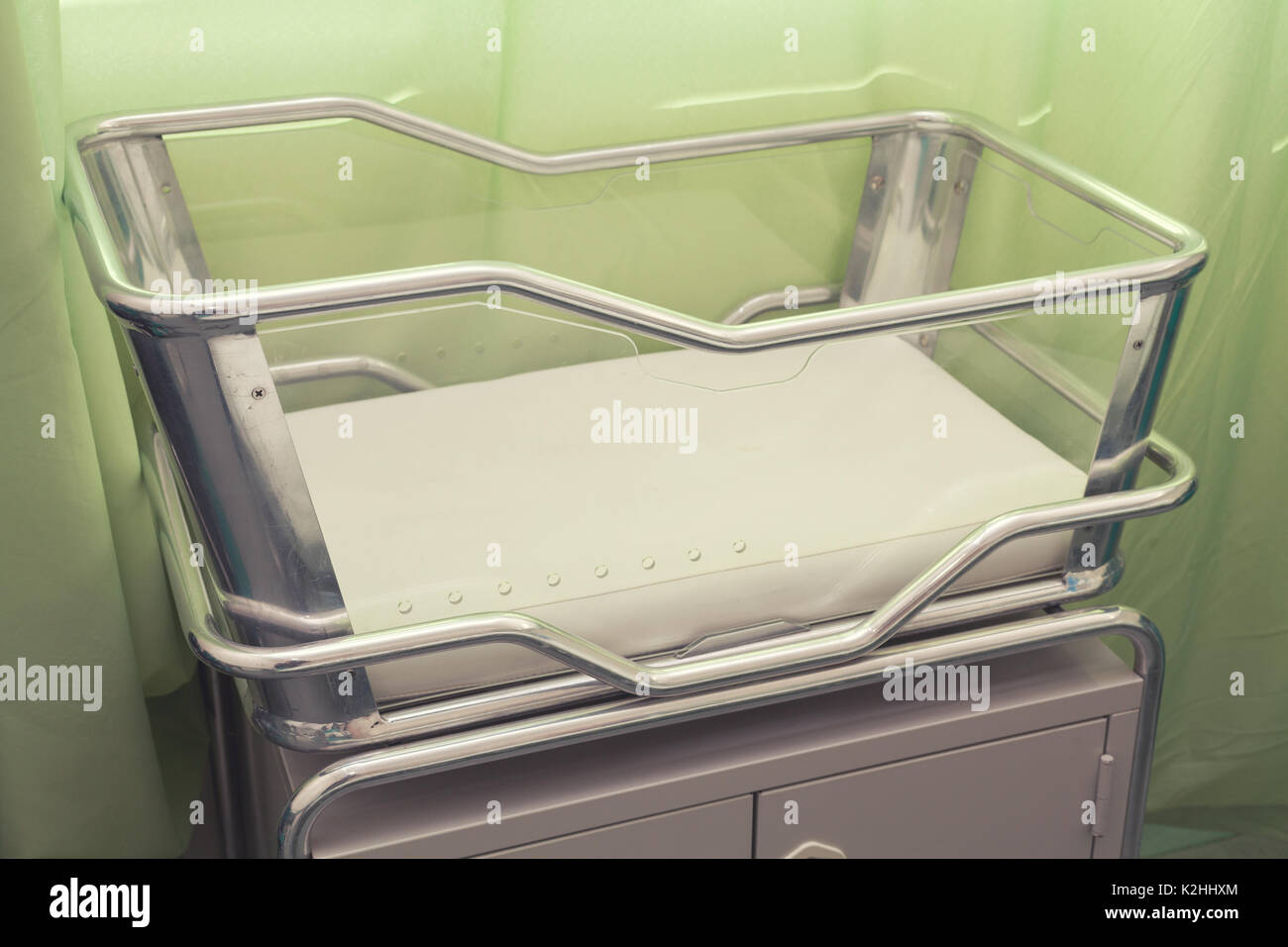 Stainless Steel Hospital Baby Cot with green background Stock Photo Alamy