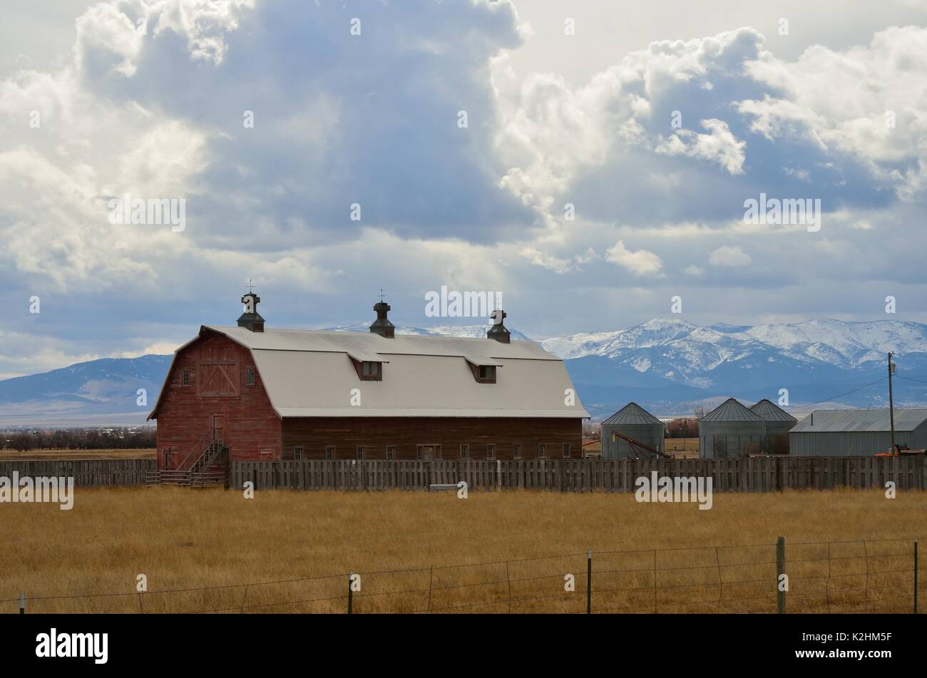Large Red Barn with Silos Stock Photo