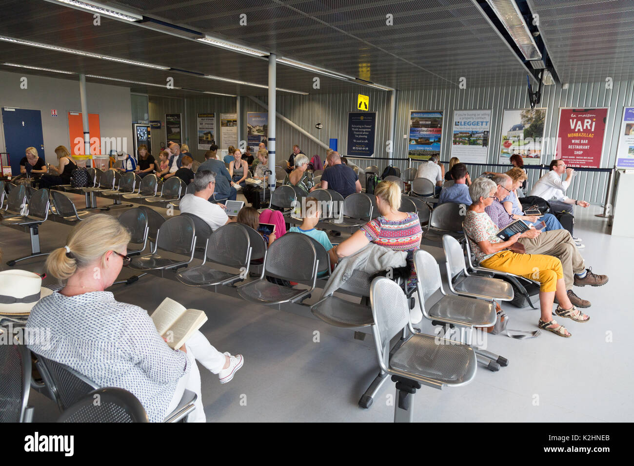 Bergerac airport departures, - People waiting in the departure lounge, Bergerac airport, Bergerac, Dordogne, France Europe Stock Photo