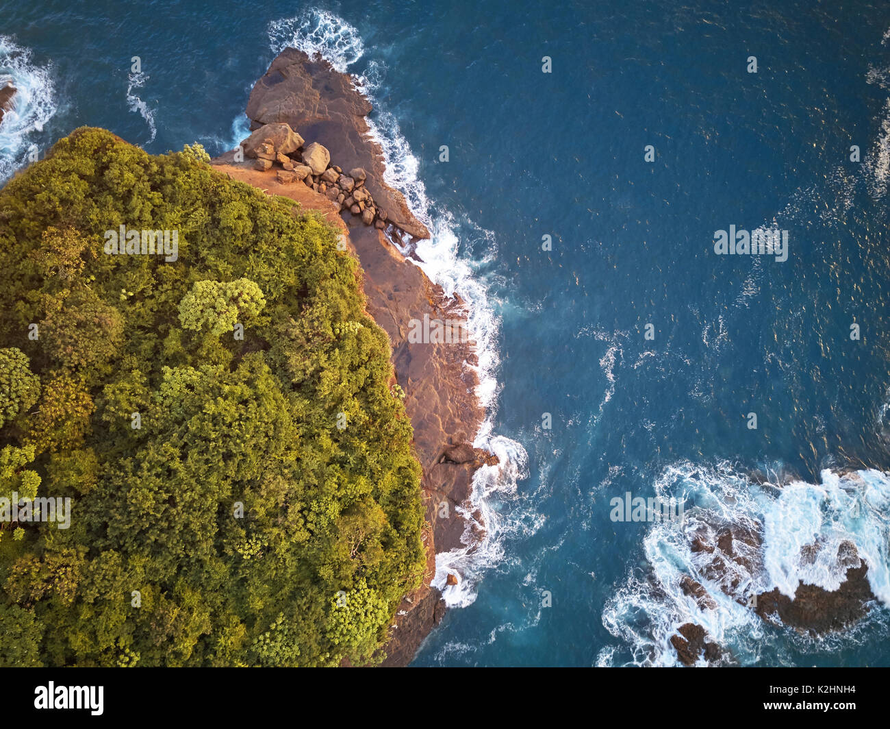 Sunset in tropical island shore above aerial view Stock Photo