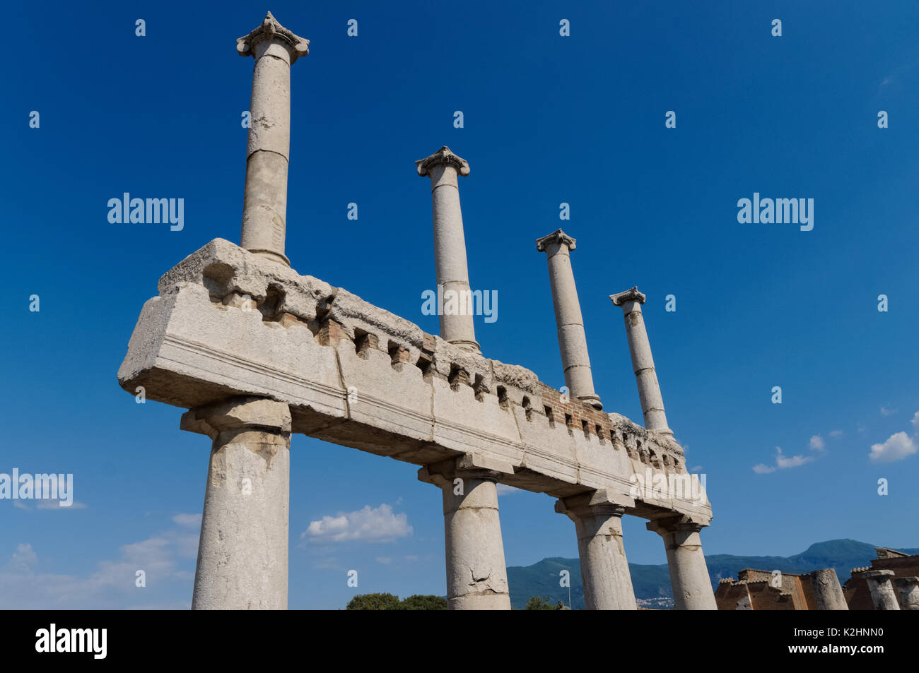 Remains of colonnade at the Roman ruins of Pompeii, Italy Stock Photo