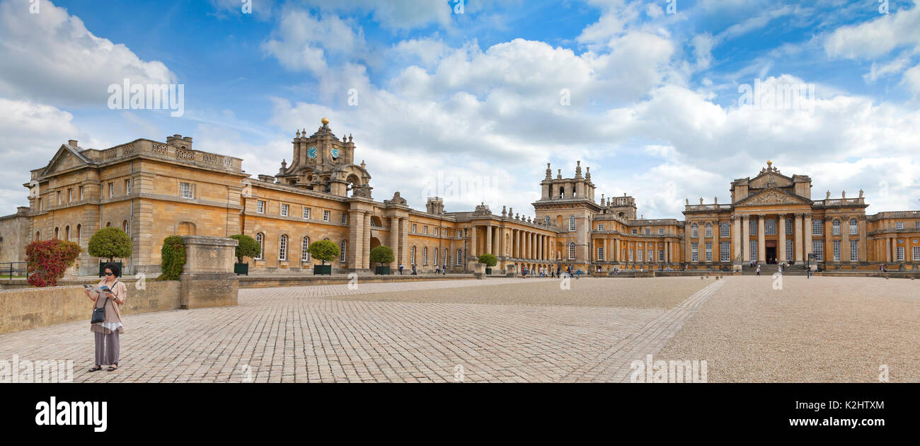 Blenheim Palace, Woodstock. UK, view of the front aspect & Eastern wing, a lone tourist inspects a map. Stock Photo