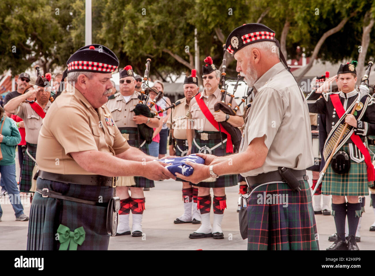 A Scottish American flag of honor is presented in solemn ceremony at an ethnic festival in Costa Mesa, CA. Stock Photo