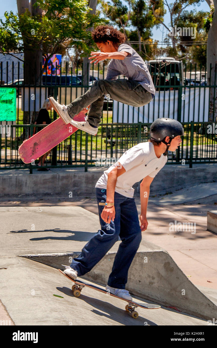 Skateboarders of both sexes compete in a Costa Mesa, CA, skateboard park. Stock Photo