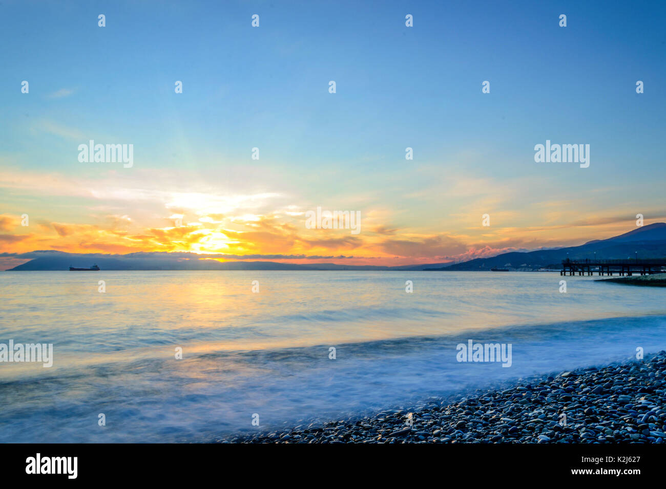 Beautiful natural sunset over sea Stock Photo - Alamy