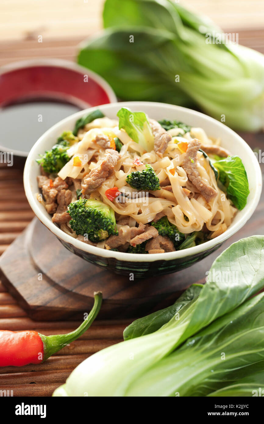 Rice noodles with beef and broccoli Stock Photo Alamy
