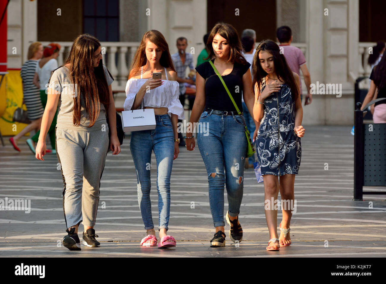 People walking on the Fountains Square in Baku. Stock Photo