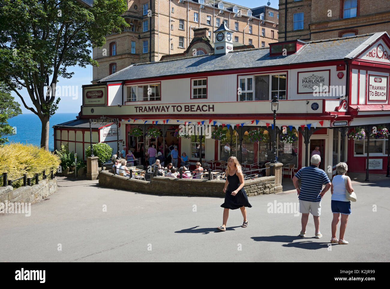 People visitors tourists and Tramway station and cafe in summer Scarborough town resort North Yorkshire England UK United Kingdom GB Great Britain Stock Photo