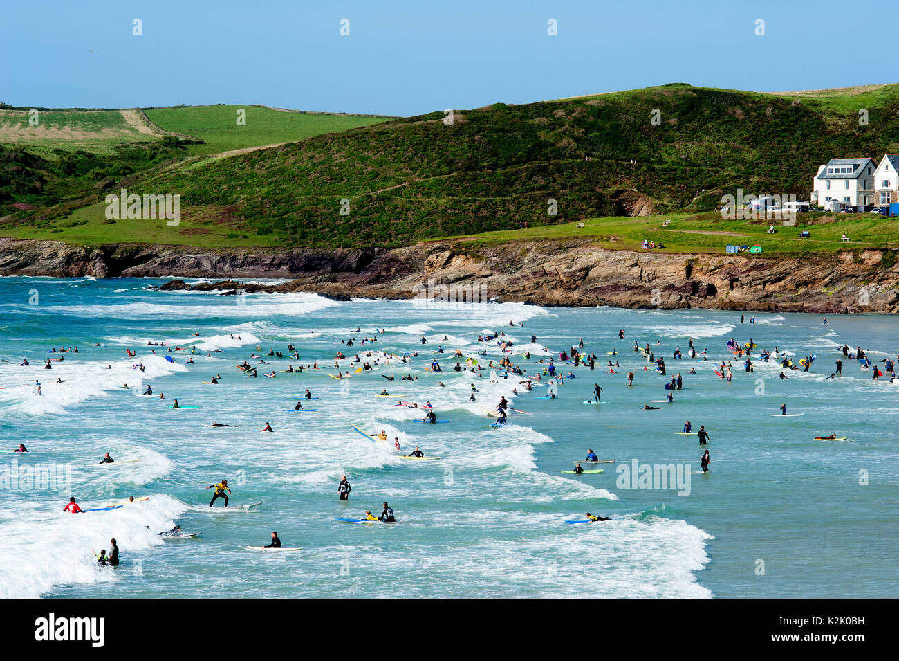 Bodyboarders and beginner surfers catching the smaller waves at