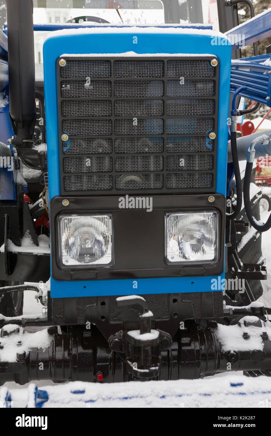 The hood of tractor - blue modern agricultural equipment Stock Photo