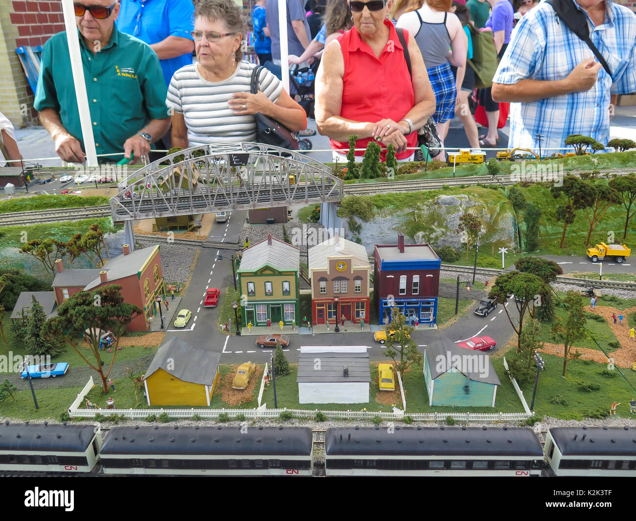 People are looking at model trains on display Stock Photo - Alamy