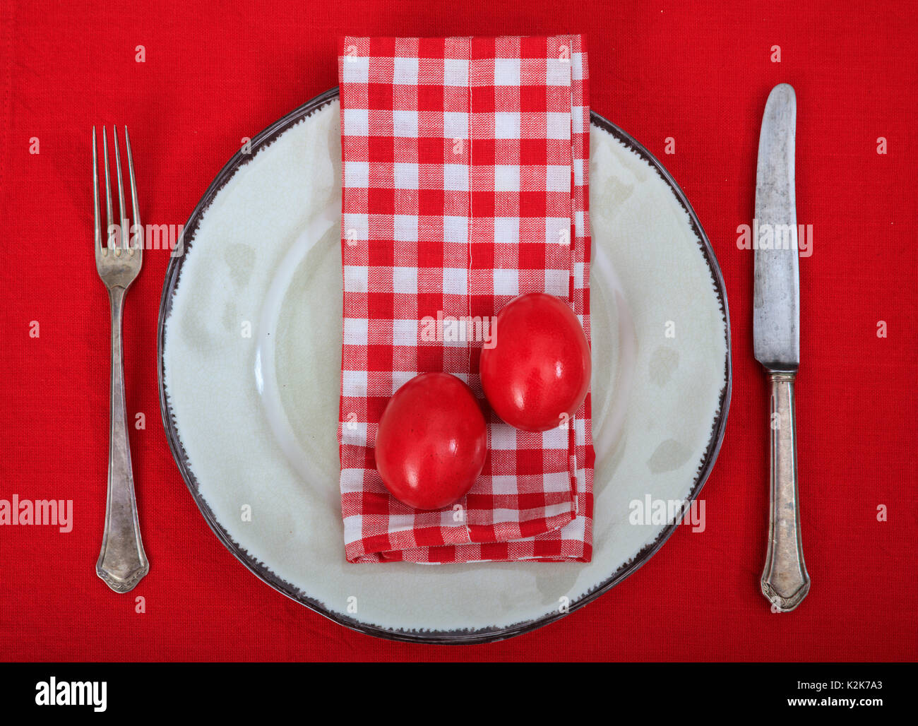 Easter eggs on a plate on red background Stock Photo
