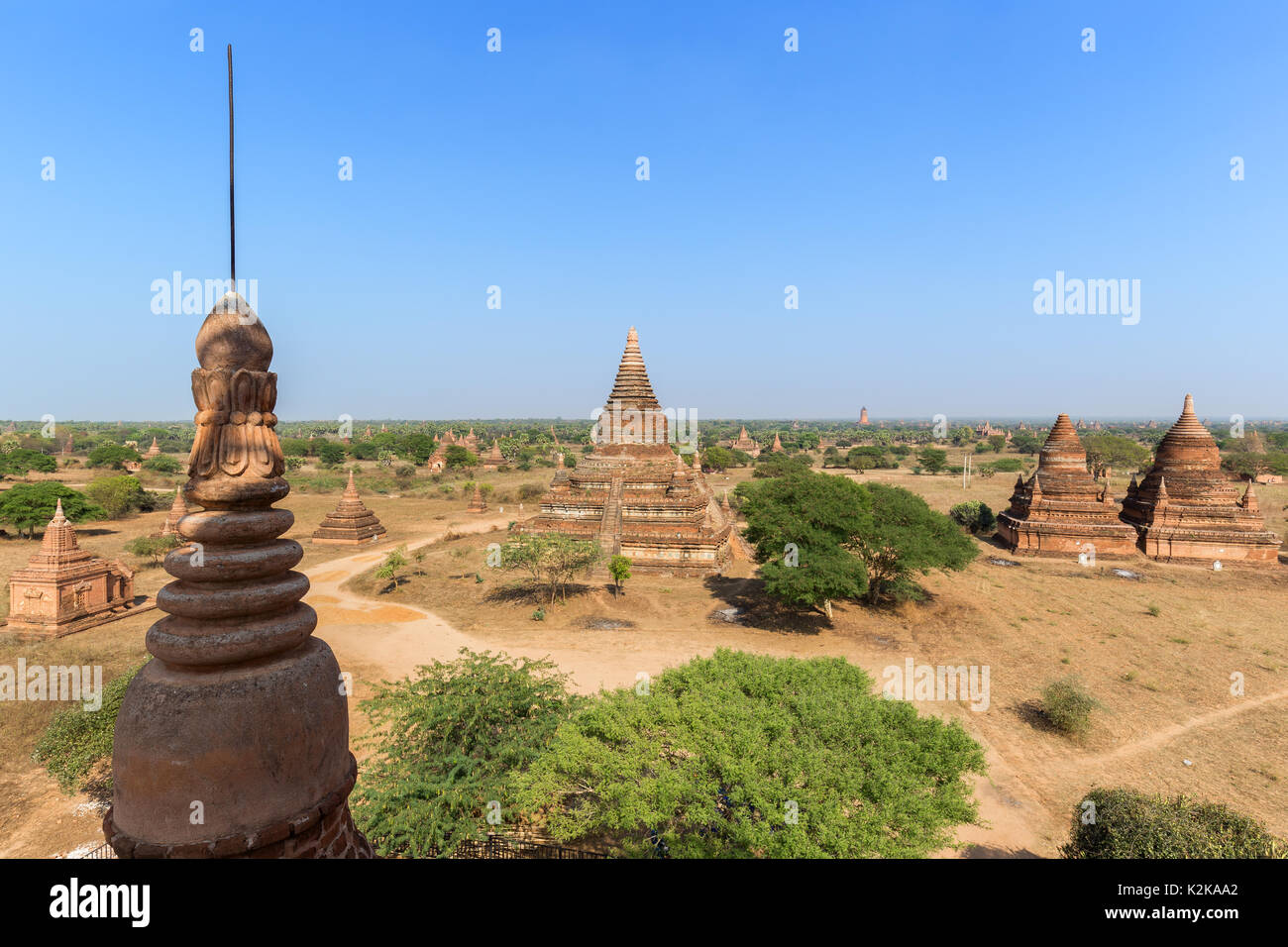 Many old pagodas and other buildings at the ancient plain of Bagan in Myanmar (Burma), viewed from the Bulethi (Buledi) Temple on a sunny day. Stock Photo