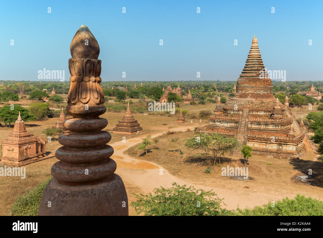 Many old pagodas and other buildings at the ancient plain of Bagan in Myanmar (Burma), viewed from the Bulethi (Buledi) Temple on a sunny day. Stock Photo