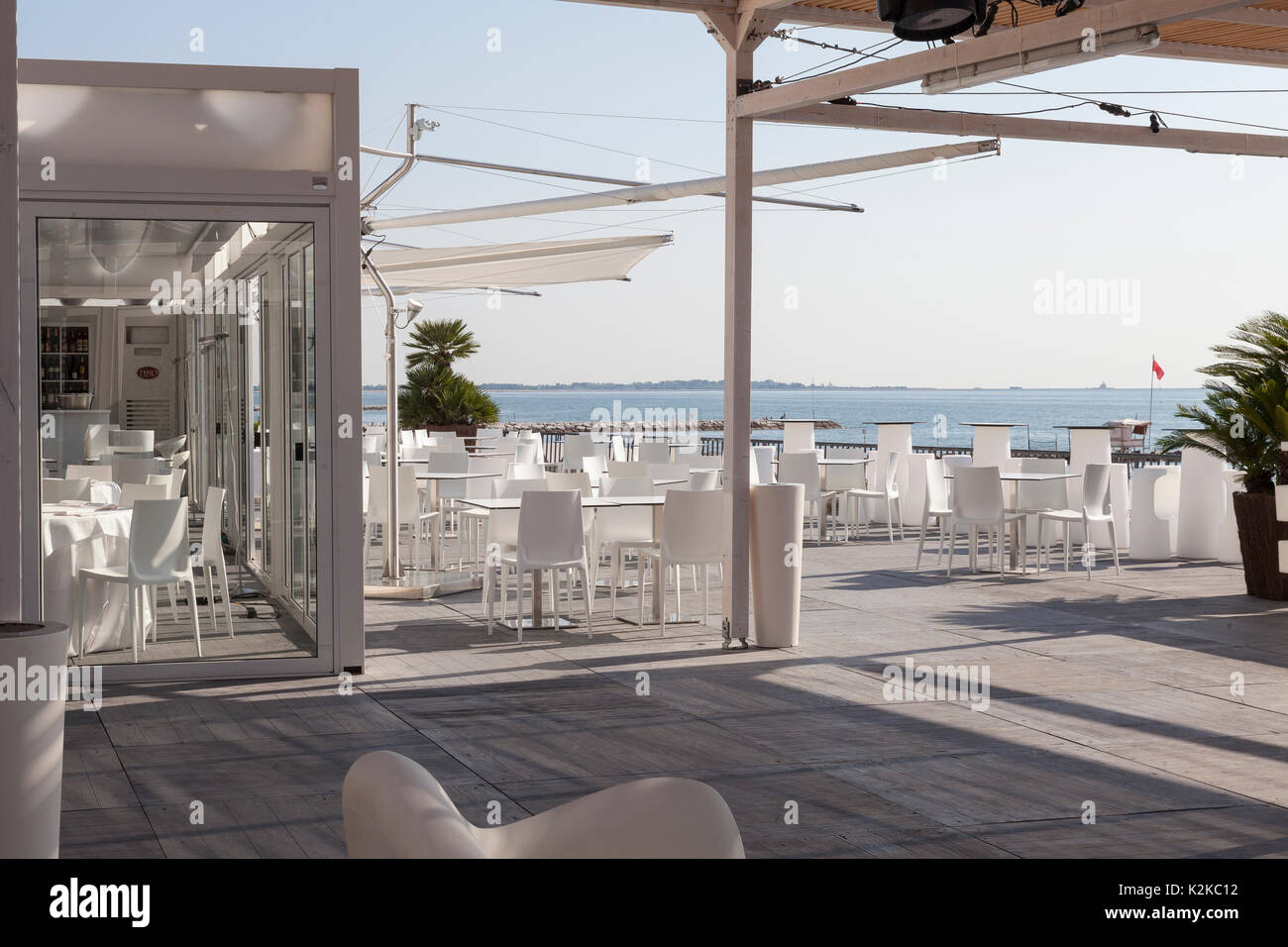 Lido, Venice, Italy. 30th Aug, 2017. Venues for the 2017 Film Festival after last minute preparations and installations and before the crowds arrive for the opening of the festival. The indoor and outdoor restaurants and seating of the official Biennale pavillion overlooking the Adriatic Sea. Stock Photo