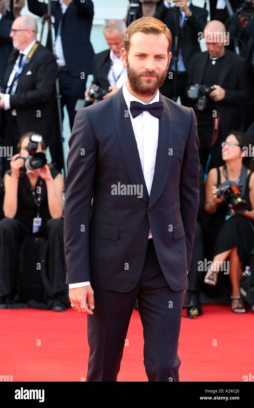 Venice, Italy. 30th Aug, 2017. VENICE, ITALY - AUGUST 30: Alessandro Borghi walks the red carpet ahead of the 'Downsizing' screening and Opening Ceremony during the 74th Venice Film Festival at Sala Grande on August 30, 2017 in Venice, Italy. Credit: Graziano Quaglia/Alamy Live News Stock Photo