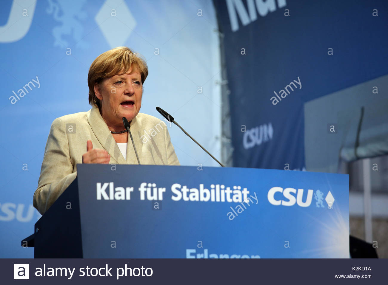 An expressive gesture as Angela Merkel speaks to a large crowd on the campaign trail in the run up to the German election which is taking place on Sunday, September 24.Merkel spoke for over forty minutes and was well received though a small group of protestors tried to interrupt her speech with whistles and catcalls. Stock Photo