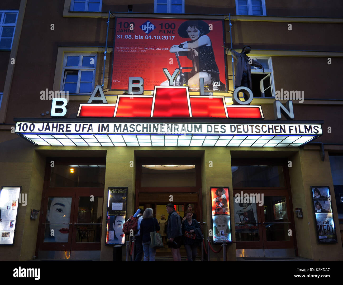 The Babylon cinema advertises the event series '100 Jahre Ufa 100 Filme' (lit. '100 Years of Ufa 100 Movies') with a photo of actress Marlene Dietrich from the movie 'Der Blaue Engel' in Berlin, Germany, 16 August 2017. Between 31 August and 4 October 2017, the Kino Babylon screens 100 movies of the UFA production studios. The Universum Film AG was founded in 1917. Photo: XAMAX/dpa Stock Photo