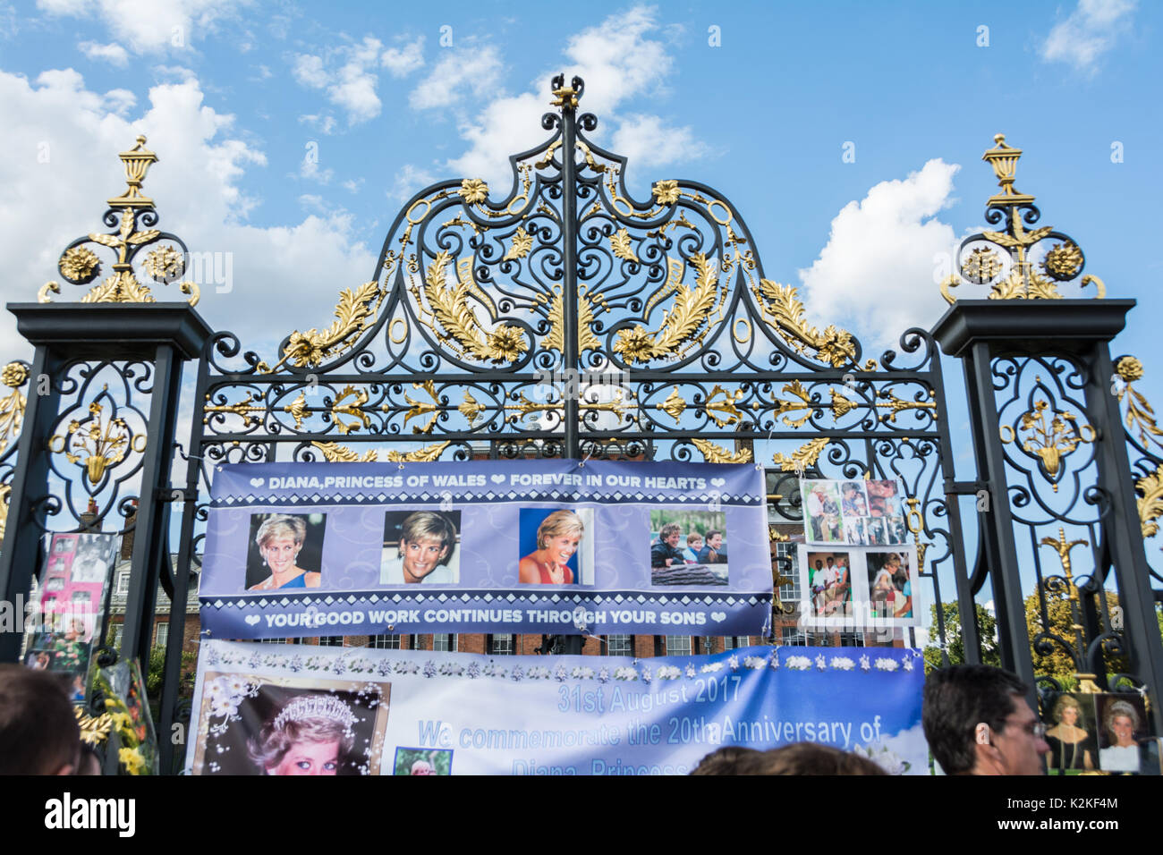 Well wishers, photographers and news crews jostle outside the gates of Kensington Palace to commemorate and pay tribute to Princess Diana, twenty years after her death. Stock Photo