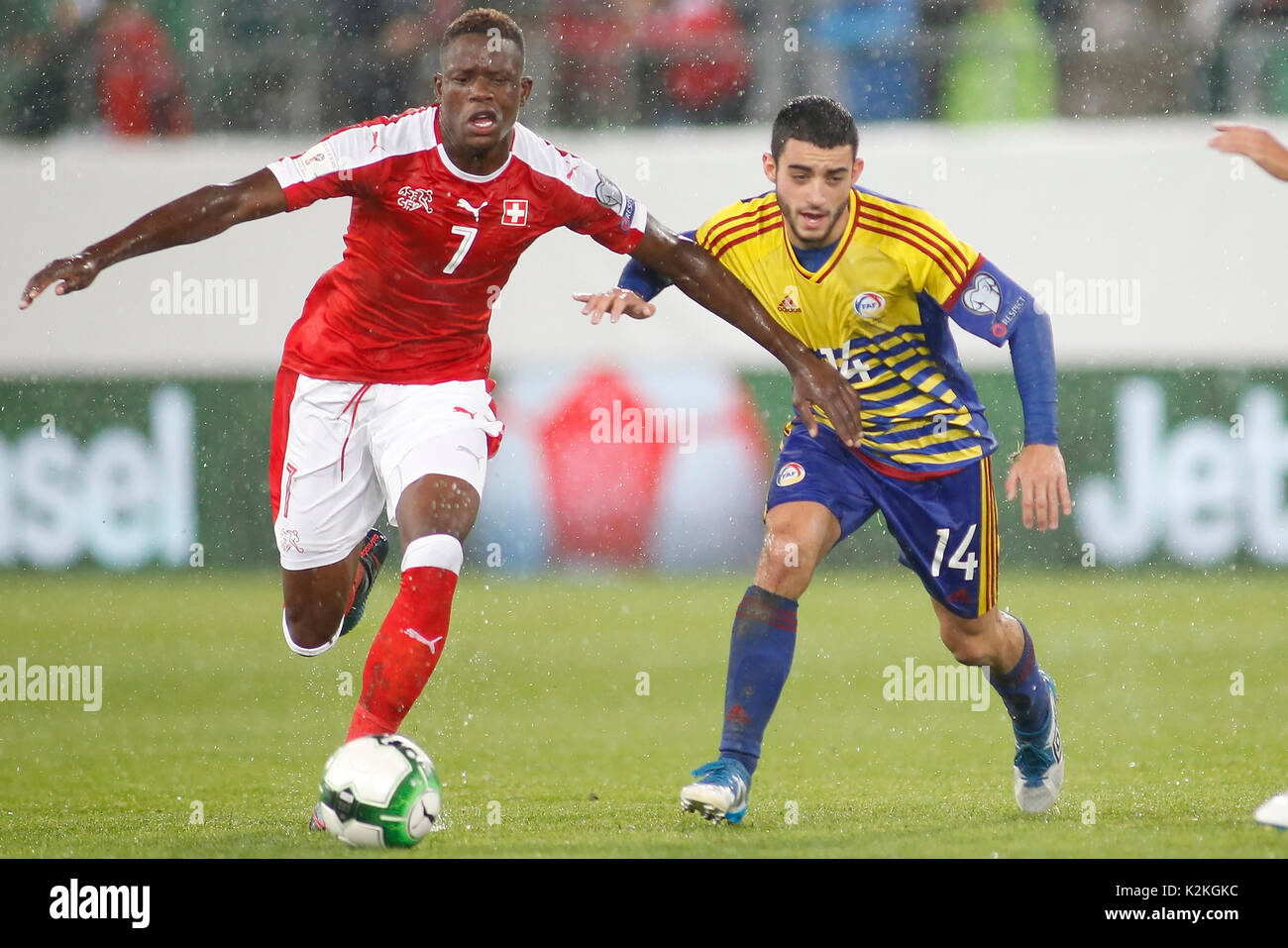 St. Gallen, Switzerland. 31st Aug, 2017. Denis Zakaria (L) of Switzerland vies with Jordi Alaez of Andorra during the FIFA World Cup 2018 Qualifiers Group B match between Switzerland and Andorra in St. Gallen, Switzerland, Aug. 31, 2017. Switzerland won 3-0. Credit: Michele Limina/Xinhua/Alamy Live News Stock Photo