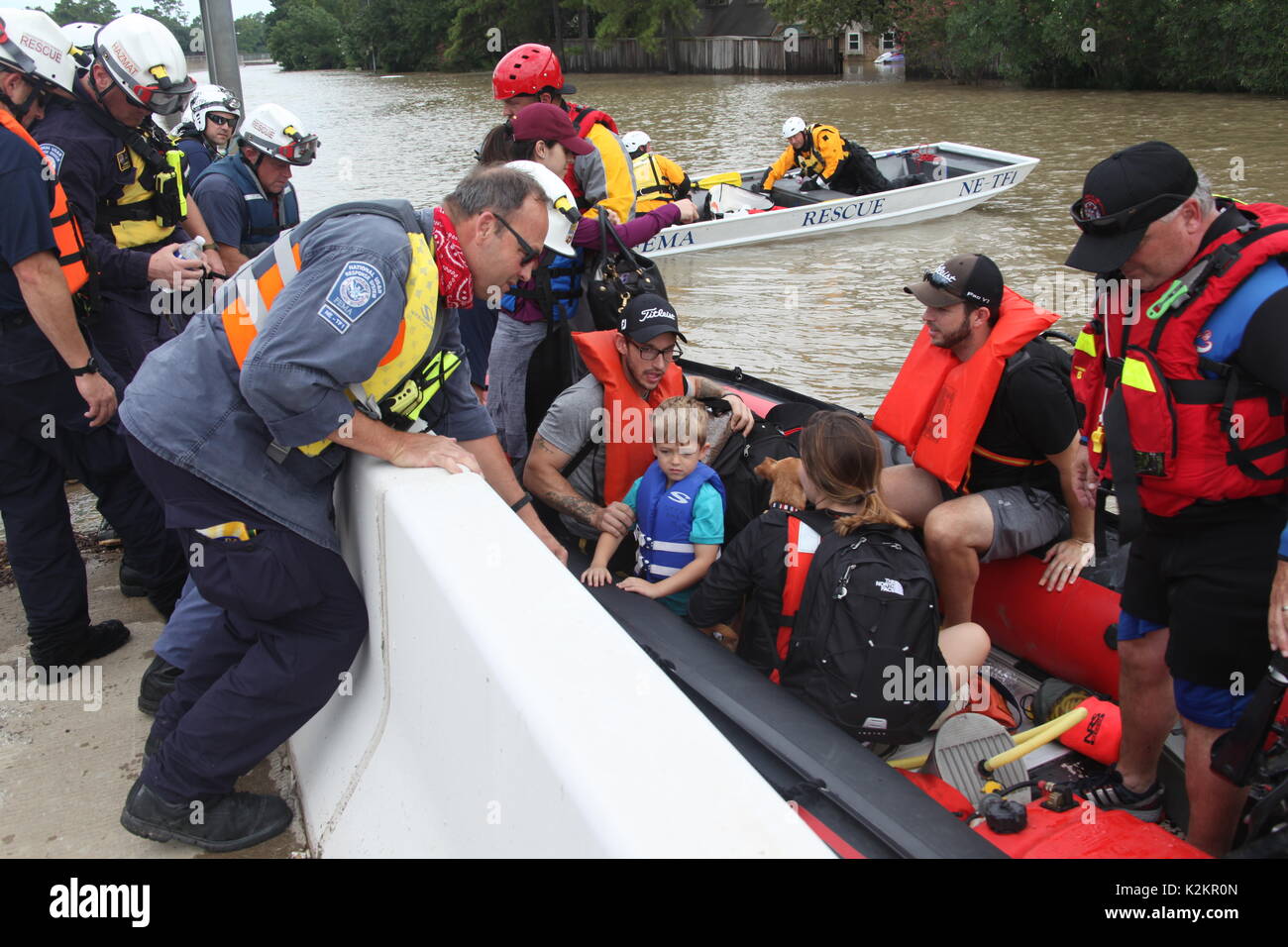 Houston, United States. 31st Aug, 2017. Urban Search and Rescue Nebraska Task Force One personnel rescue a family from flood waters in the aftermath of Hurricane Harvey August 31, 2017 in Houston, Texas. Credit: Planetpix/Alamy Live News Stock Photo