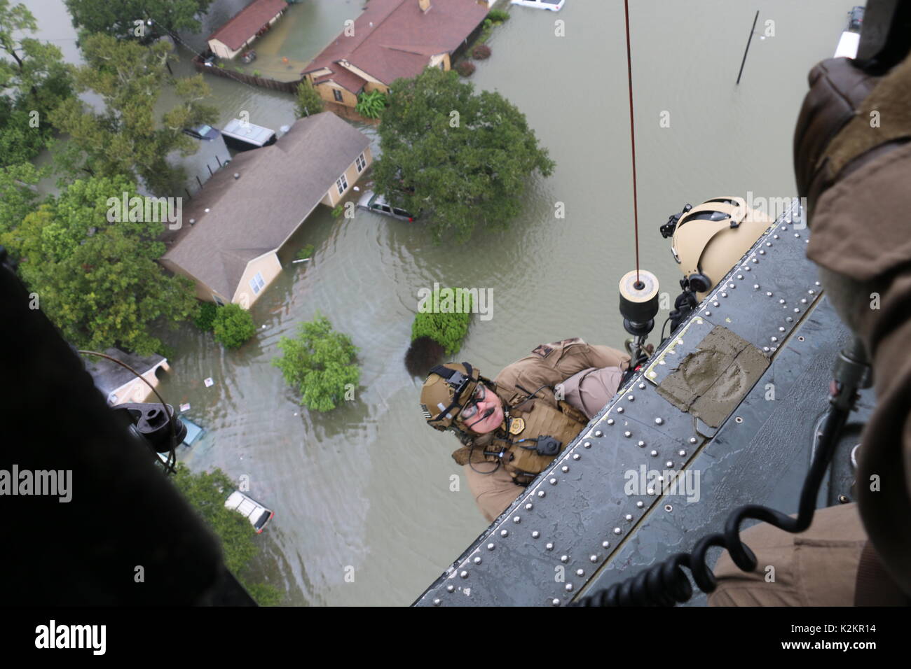Houston, United States. 30th Aug, 2017. U.S CBP Air and Marine Operations aircrew are lowered from a helicopter to evacuate residents from a neighborhood flooded by rising waters in the aftermath of Hurricane Harvey August 30, 2017 in Houston, Texas. Credit: Planetpix/Alamy Live News Stock Photo