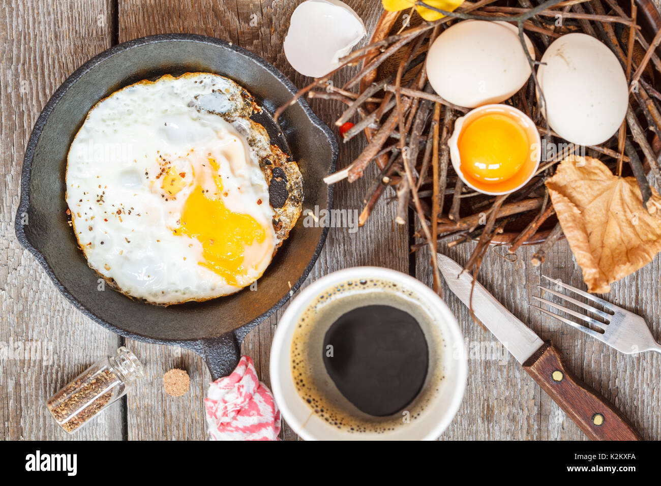 autumn breakfast in nature, coffee and fried egg Stock Photo