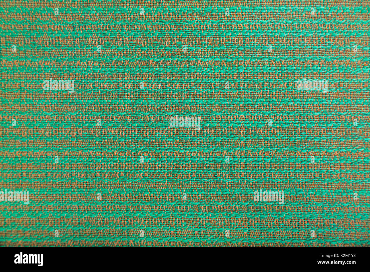 Wool fabric with bright green and brown geometric minimalistic pattern in the form of lines. Stock Photo
