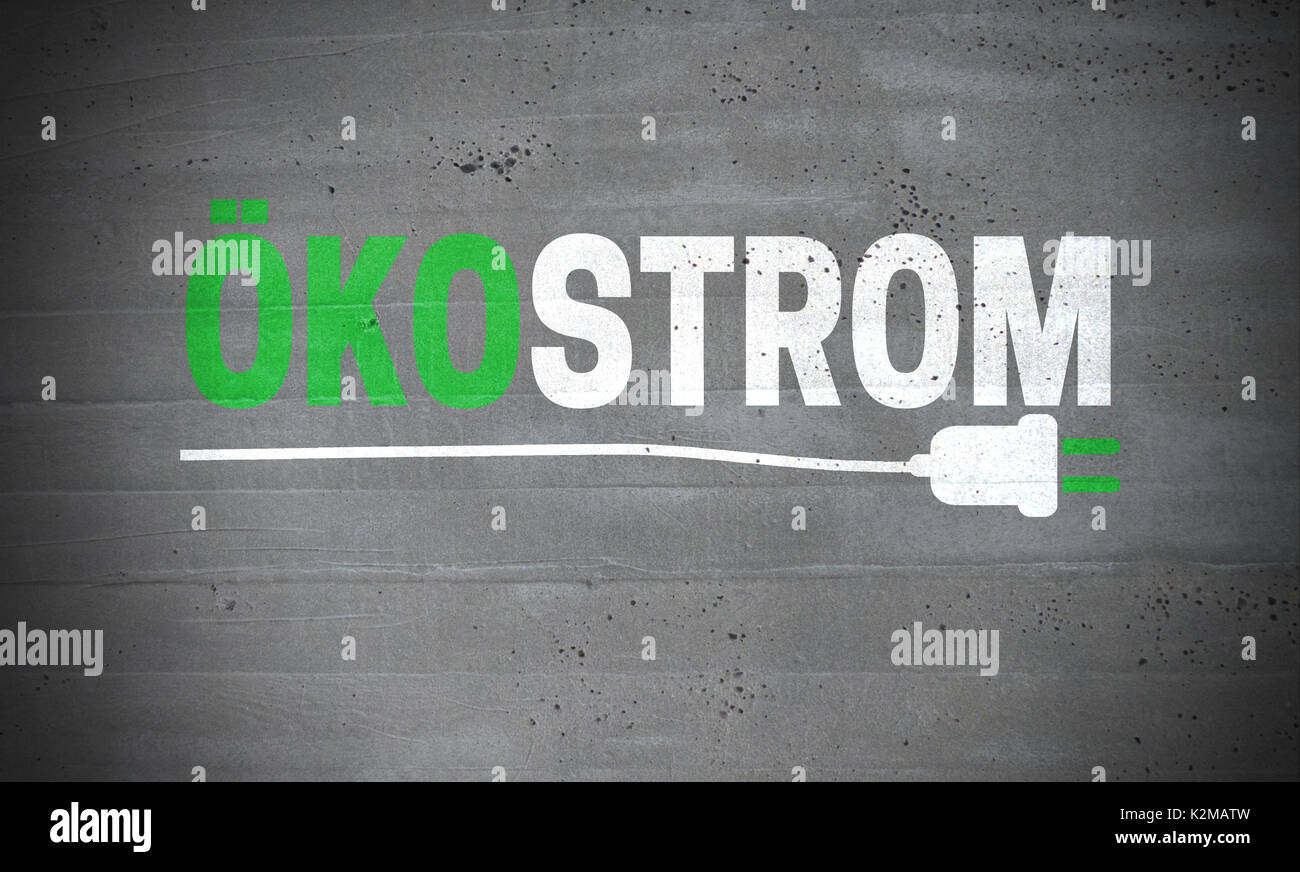 Oekostrom (in german Green electricity) on concrete wall concept background. Stock Photo