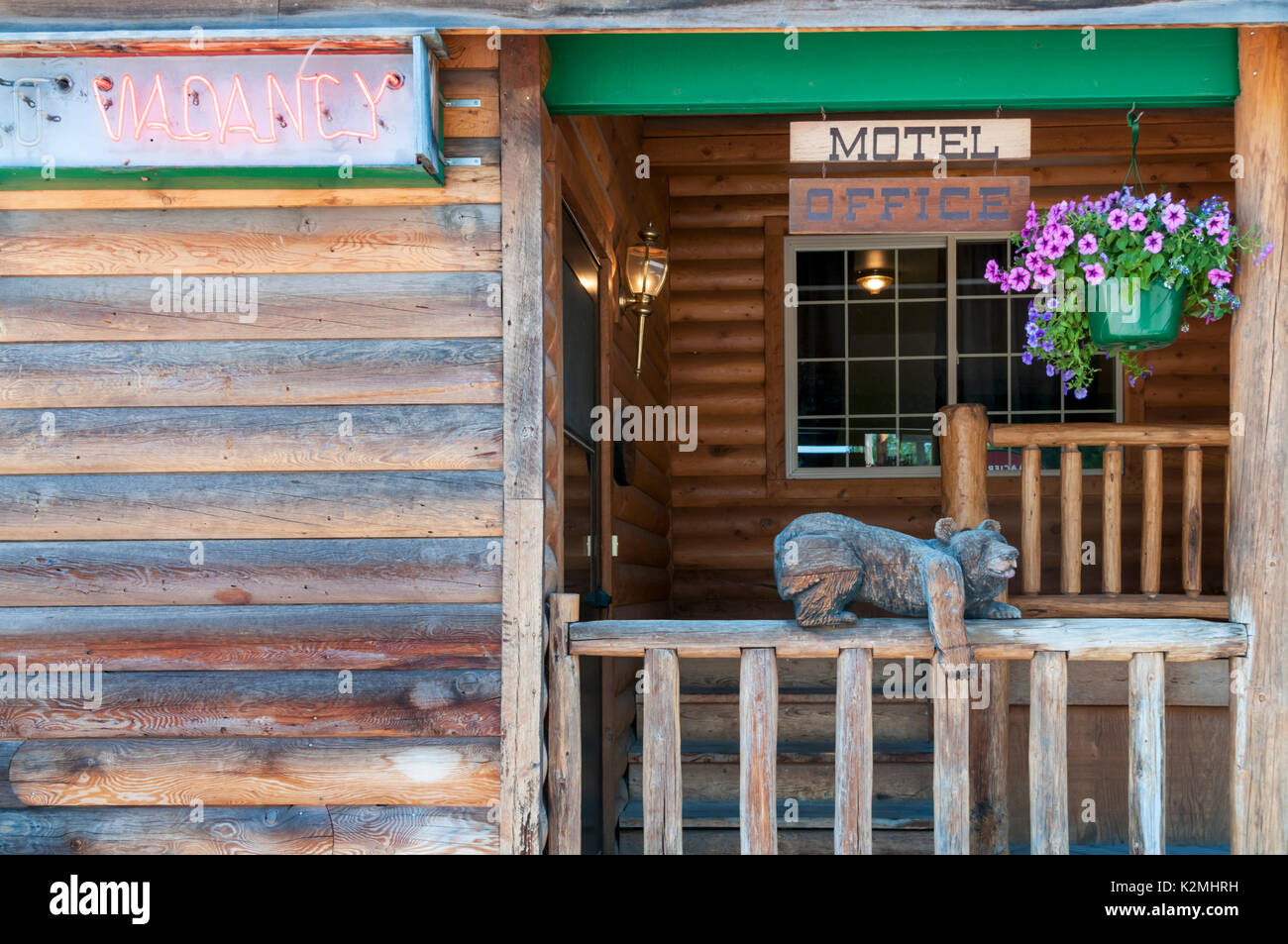Wooden carving of a bear on entrance to motel in West Glacier, Montana, USA Stock Photo