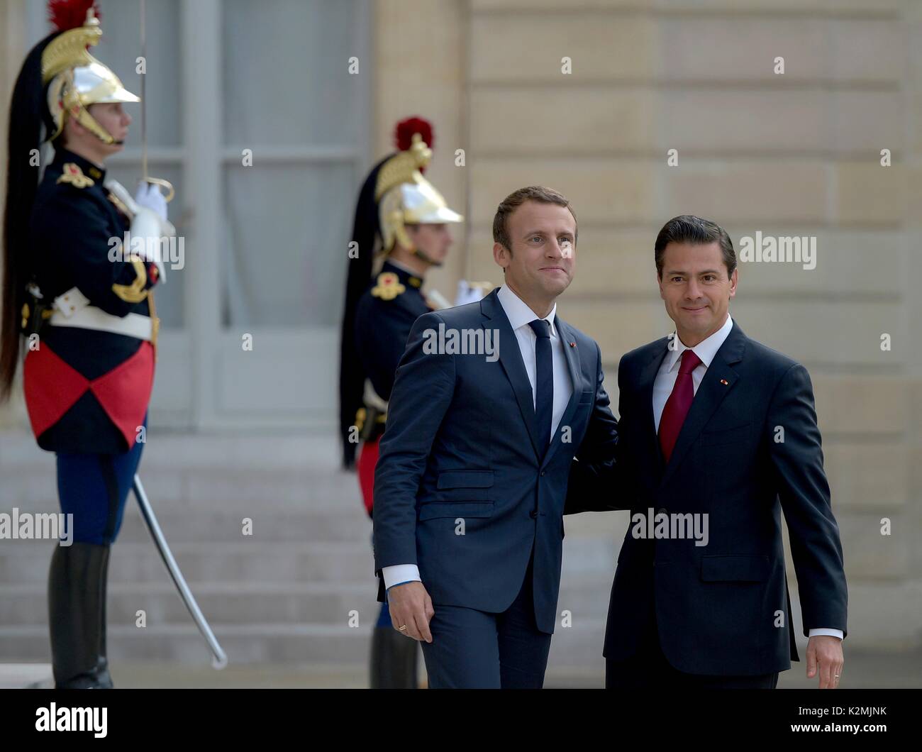 French President Emmanuel Macron welcomes Mexican President Enrique Pena Nieto, right, to the Elysee Palace for meeting July 7, 2017 in Paris, France. Stock Photo