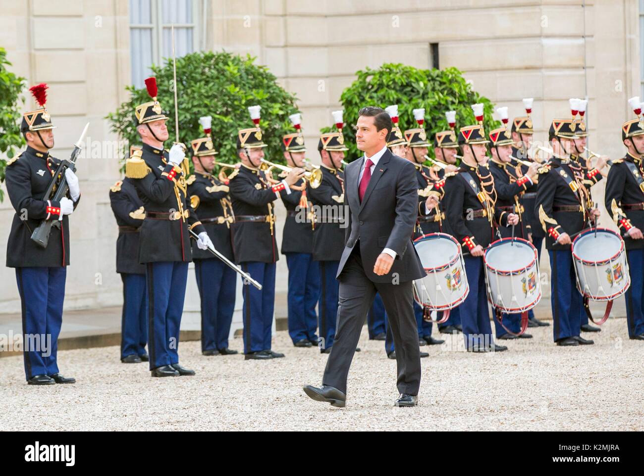 Mexican President Enrique Pena Nieto reviews the troops during arrival ceremonies at the Elysee Palace for meeting with French President Emmanuel Macron July 7, 2017 in Paris, France. Stock Photo
