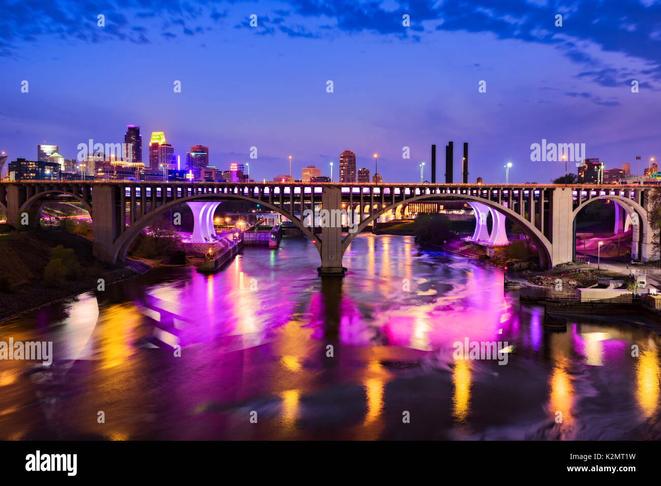Colorful lights of the Interstate 35W bridge reflected in the Mississippi River at Minneapolis