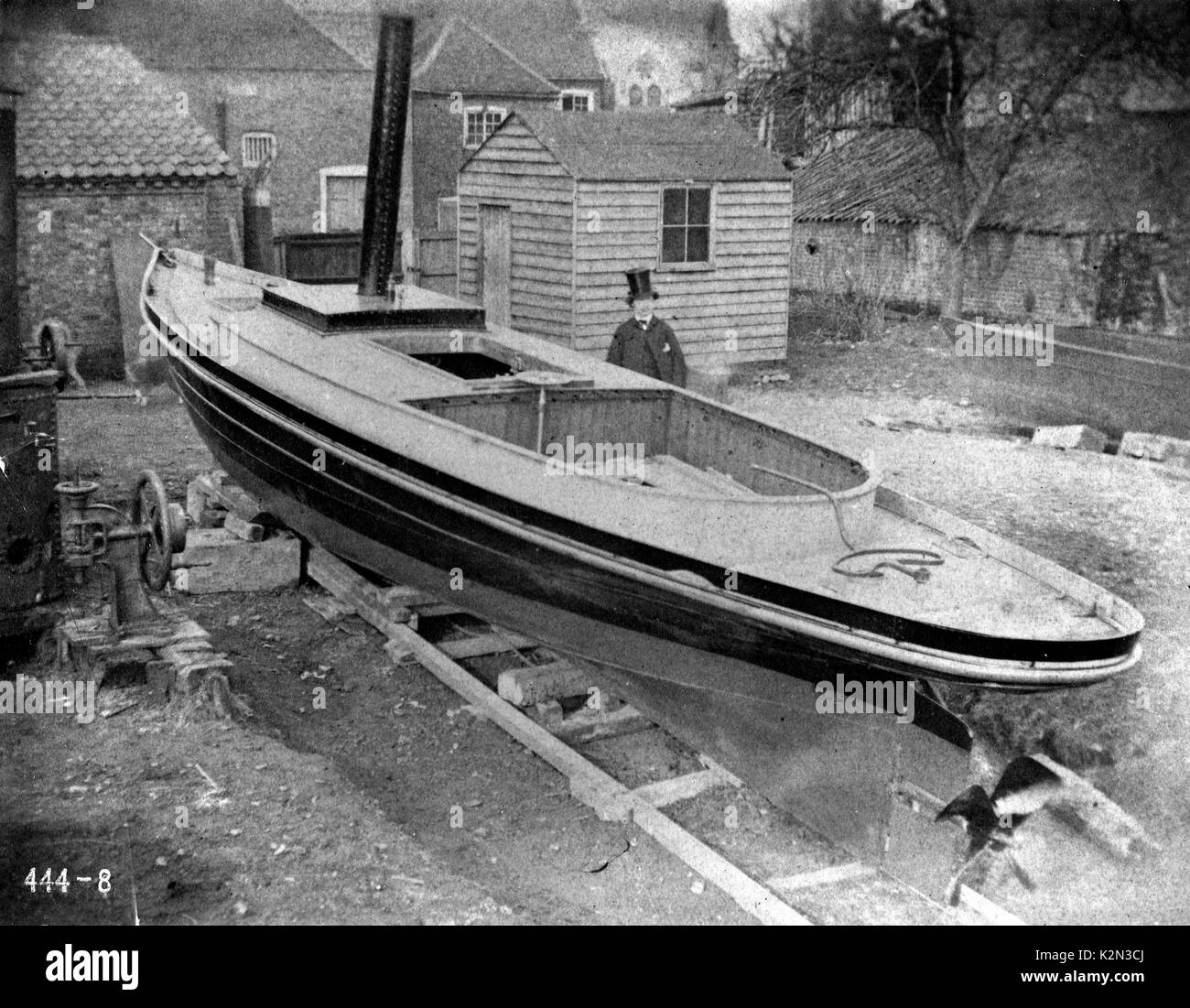 AJAXNETPHOTO - 1858 - RIVER THAMES, ENGLAND. Shipbuilder J.Thornycroft in stove pipe hat stands proudly beside his creation 'Nautilus' on the banks of the Thames, from a glass plate negative dated 1858.  PHOTO:VT COLLECTION/AJAX REF AVL VT NAUTILUS A444 8 V2 Stock Photo