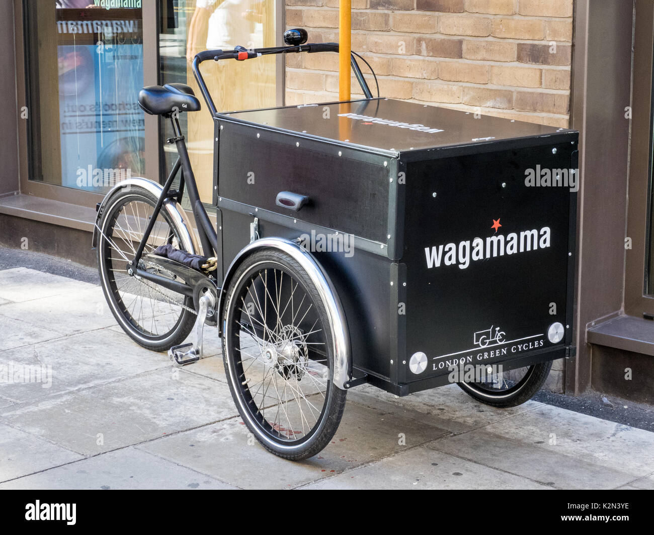 Cargo Bike for food deliveries from the Wagamama Asian Fusion food restaurant in Soho, central London UK Stock Photo