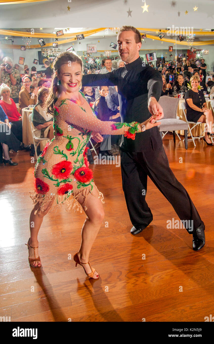 Professional ballroom dancers perform at a dance school anniversary
