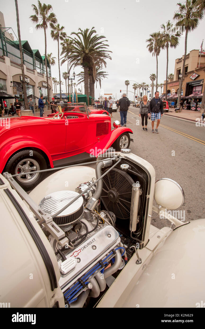 A  1932 Chevrolet roadster hot rod and a red 1930 Ford roadster are on display at a classic car show on Main Street in Huntington Beach, CA. Stock Photo