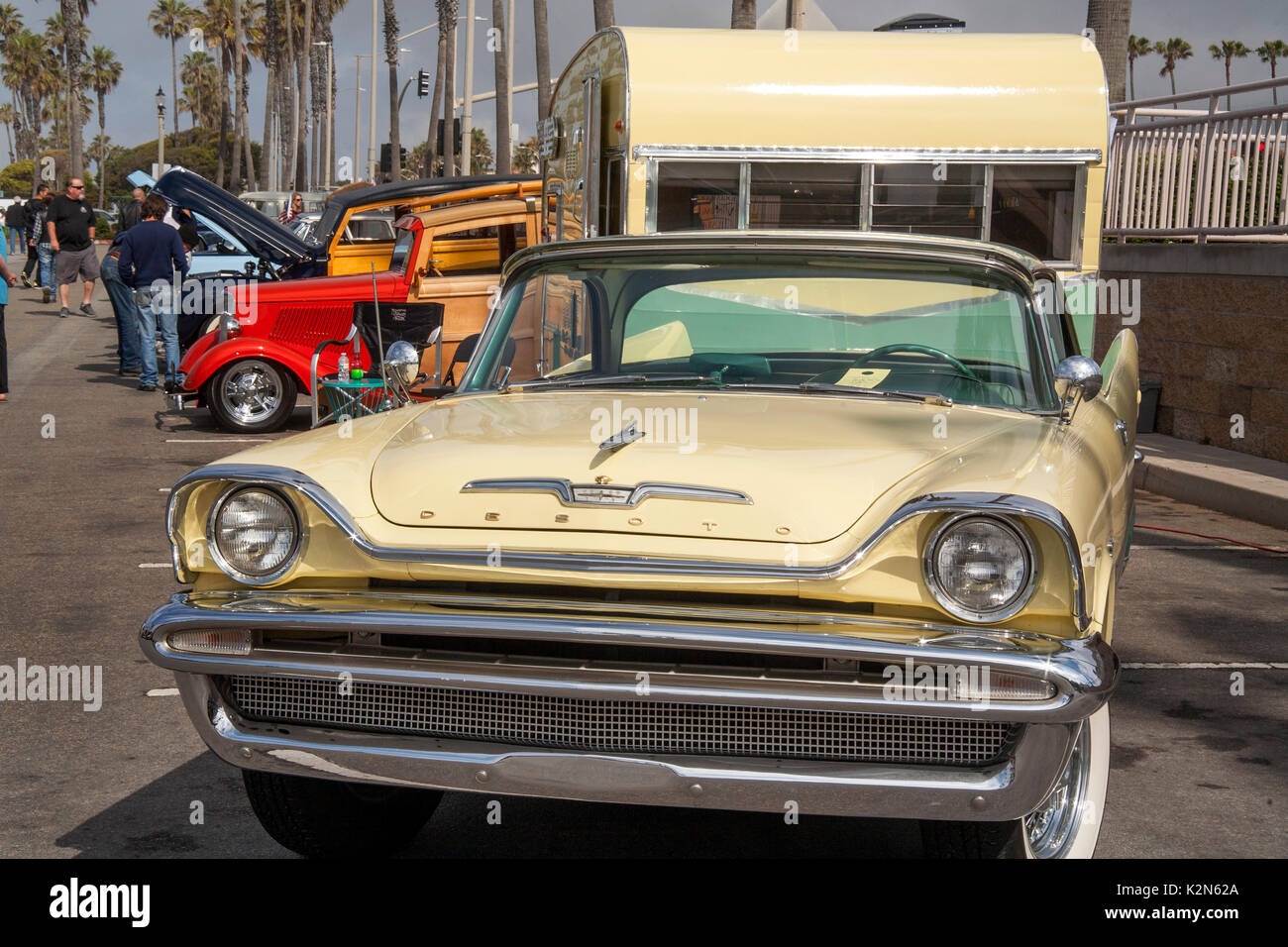 A 1957 DeSoto 'Sportsman' car is hitched to a 1962 Shasta trailer at a classic car show in Huntington Beach, CA. Note classic Ford 'woodie' in background. Stock Photo