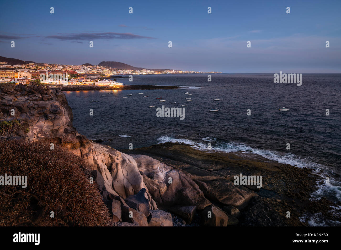 Coast of La Caleta, behind coast Costa Adeje and beach Playa de la Americas, at night, Isora, Tenerife, Canary Islands, Spain Stock Photo